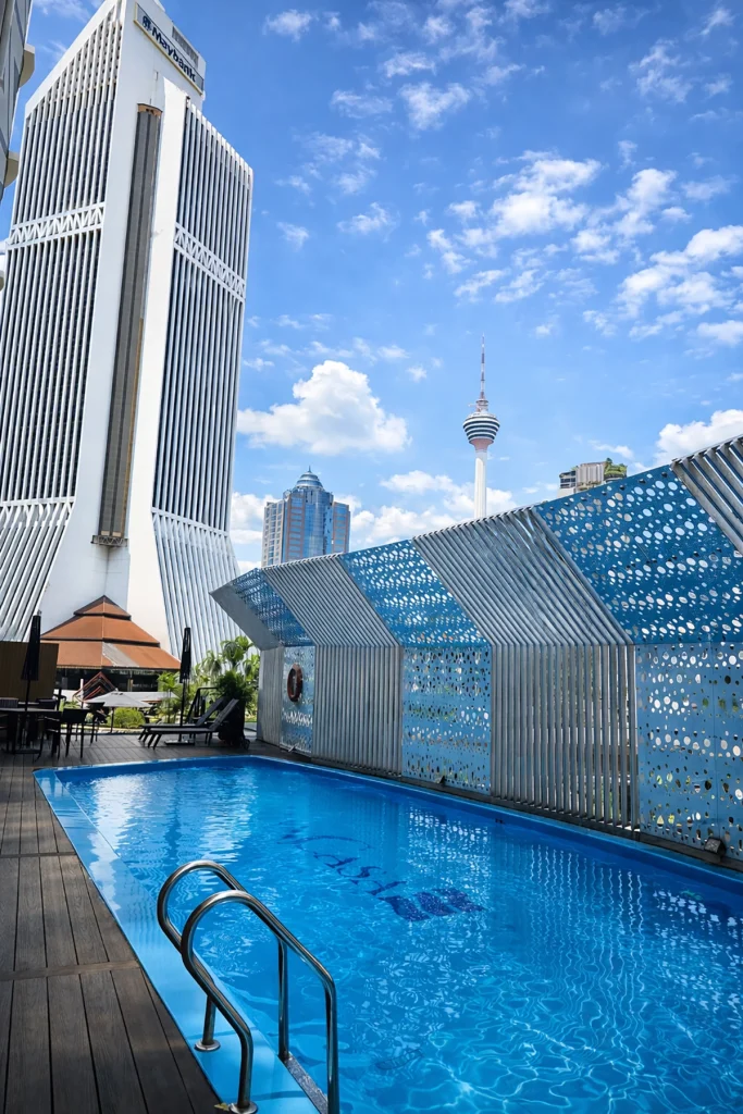 Hotel pool view near Yoyoy Kamphora Spa Kuala Lumpur with KL Tower