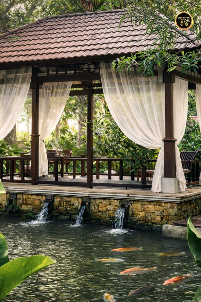Traditional spa pavilion over koi pond at Yoyoy Kamphora Spa AnCasa Resort Port Dickson